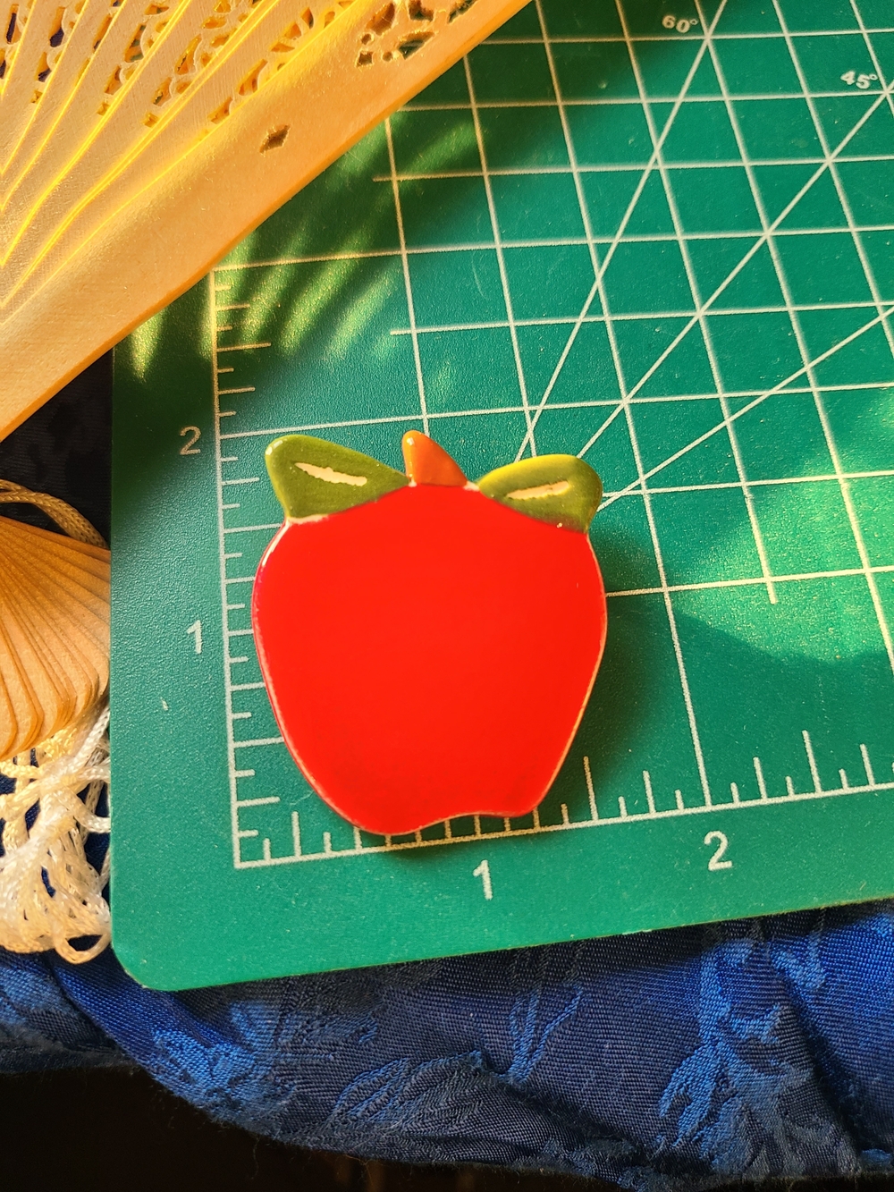 Vintage Red Apple Pin with Green Leaf Accents
